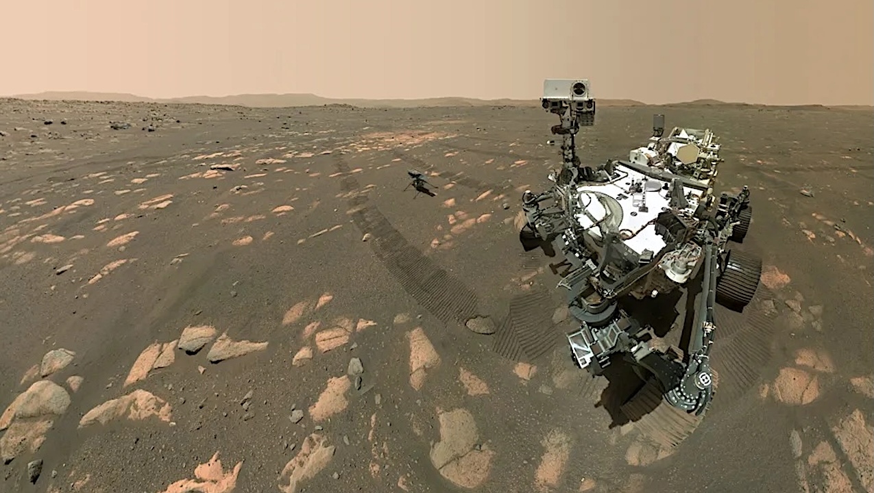 NASA’s Perseverance Mars rover took a selfie with the Ingenuity helicopter, seen here about 13 feet (3.9 meters) from the rover. This image was taken by the WASTON camera on the rover’s robotic arm on April 6, 2021, the 46th Martian day, or sol, of the mission. Credits: NASA/JPL-Caltech/MSSS
