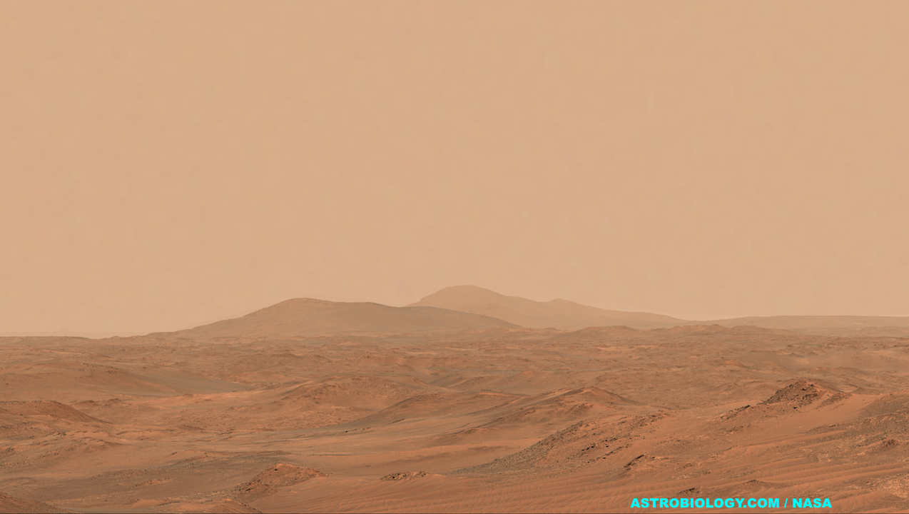 NASA’s Perseverance Mars rover captured this view of a location nicknamed “Mont Musard” on Sept. 8, 2025. Made up of three images, the panorama also captures another region, “Lac de Charmes,” where the rover’s team will be looking for more rock core samples to collect in the year ahead. Credit: NASA/JPL-Caltech/ASU/MSSS (sky modified by Astrobiology.com) Full Image Details