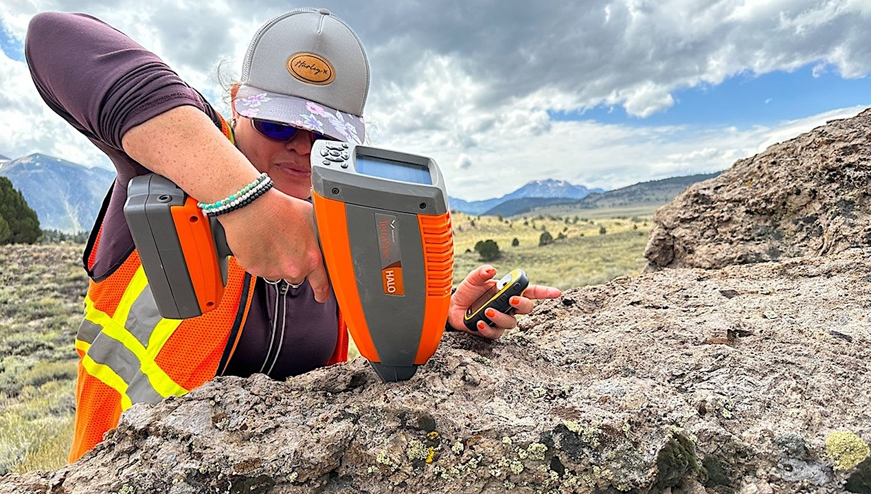 Alexandra Matiella Novak uses a hand-held spectrometer in the field. -- NASA/Caela Barry